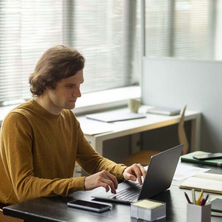 side-view-man-working-laptop